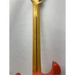 Japanese Squier Fender 'Hank Marvin' Stratocaster electric guitar, c1992, in Fiesta red with tremolo arm and facsimile signature decal; serial no.L037281, L98cm; in hard carrying case.