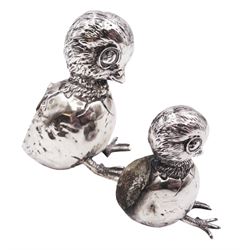 Two Edwardian silver novelty pin cushions, each modelled as a hatching chick, with cushioned backs, both hallmarked Birmingham 1910, maker's mark indistinct, largest H5.7cm