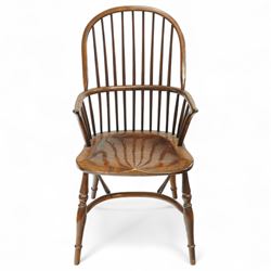 Late 19th century ash and elm Windsor armchair, with hooped back and spindle supports, shaped elm saddle seat, on turned legs united by crinoline stretcher