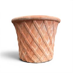 Three terracotta planters with lattice relief and rolled rim