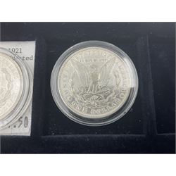 Seven United States of America silver Morgan dollar coins, dated 1884, 1901 O, 1902 O, 1903, 1904 O, 1921 D and 1921