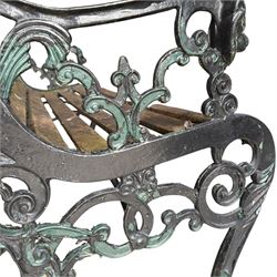 Pair of Victorian Revival Coalbrookdale design 'Dog and Serpent' pattern benches with slatted seats, the cast iron end supports of pierced and scrolling design with dog mask arm terminals