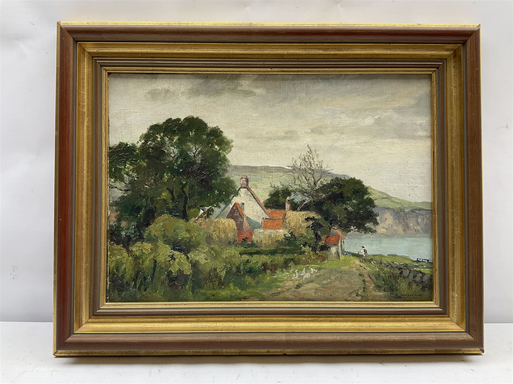 Charles Frederick Ingham (British 1879-1957): Stoupe Bank Farm looking towards Robin Hoods Bay, oil on canvas board signed 25cm x 35cm