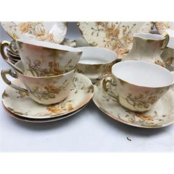 Early 20th century Limoges part tea service, decorated with floral sprays and gilt on merging peach and white ground, comprising six teacups, twelve side plates, six smaller plates, milk jug, open sucrier, slop bowl and two cake plates, many marked R Delinieres Limoges D&C France to base