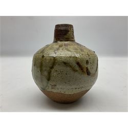 Janet Leach (American, 1918-1997) for Leach Pottery; speckled studio pottery vase of shouldered ovoid form with speckled brown decoration and trailing green and brown glaze upon beige and brown ground, with impressed J.L. monogram and Leach Pottery mark beneath, together with a Jeremy Leach blue speckled lidded circular dish with loop handle, impressed J.L, tallest H11cm