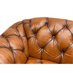 Tetrad - 'Oskar' armchair, Chesterfield shape with rolled arms, upholstered in buttoned tan leather, on turned and reed moulded feet 