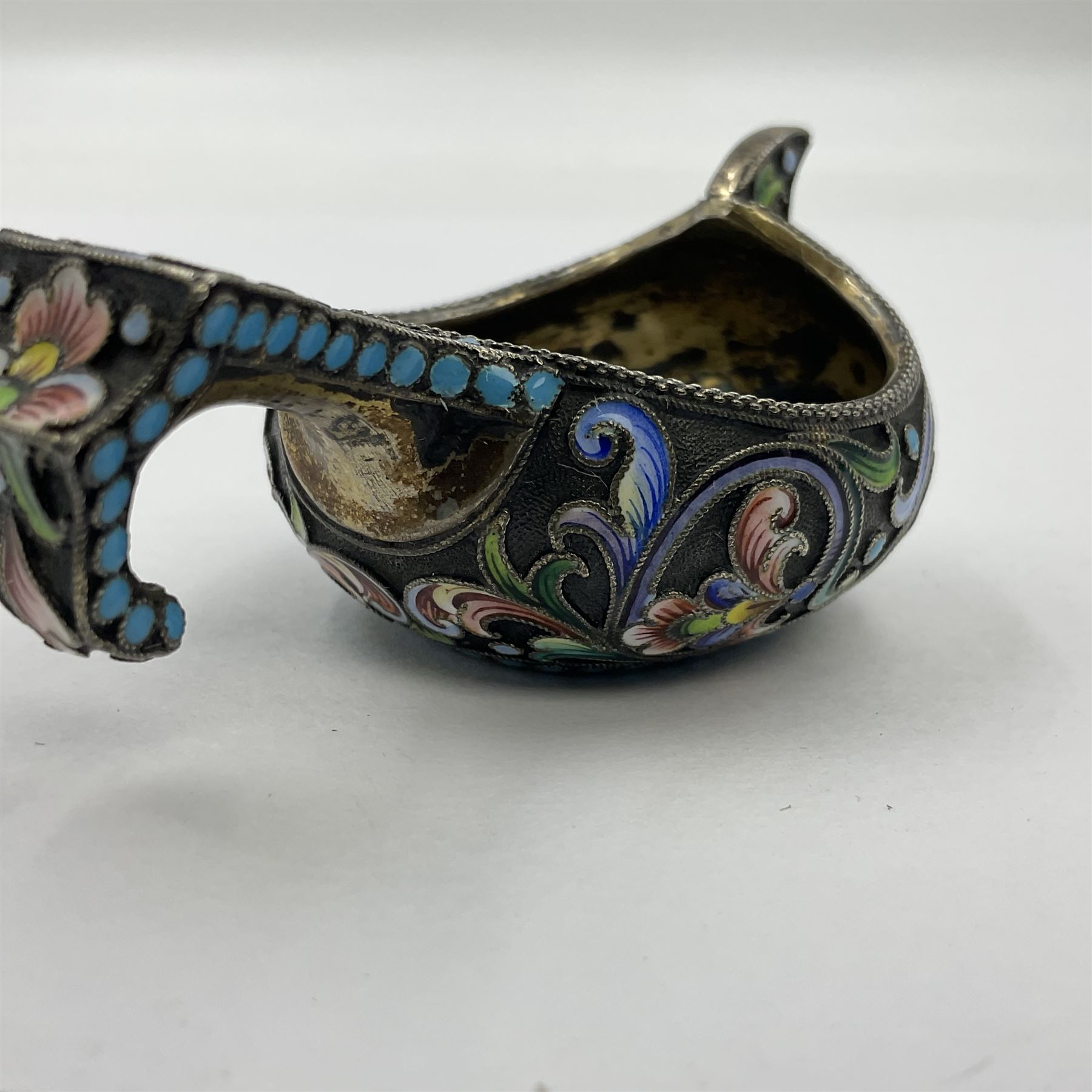 Late 19th century Russian silver kovsh, the body with polychrome cloisonne enamel floral decoration and turquoise enamel bead borders to base and handle, marked beneath with Kokoshnik mark, 84 standard, makers mark MC, possibly for Mikhail Fyodorovich Sokolov, L7cm, H3cm