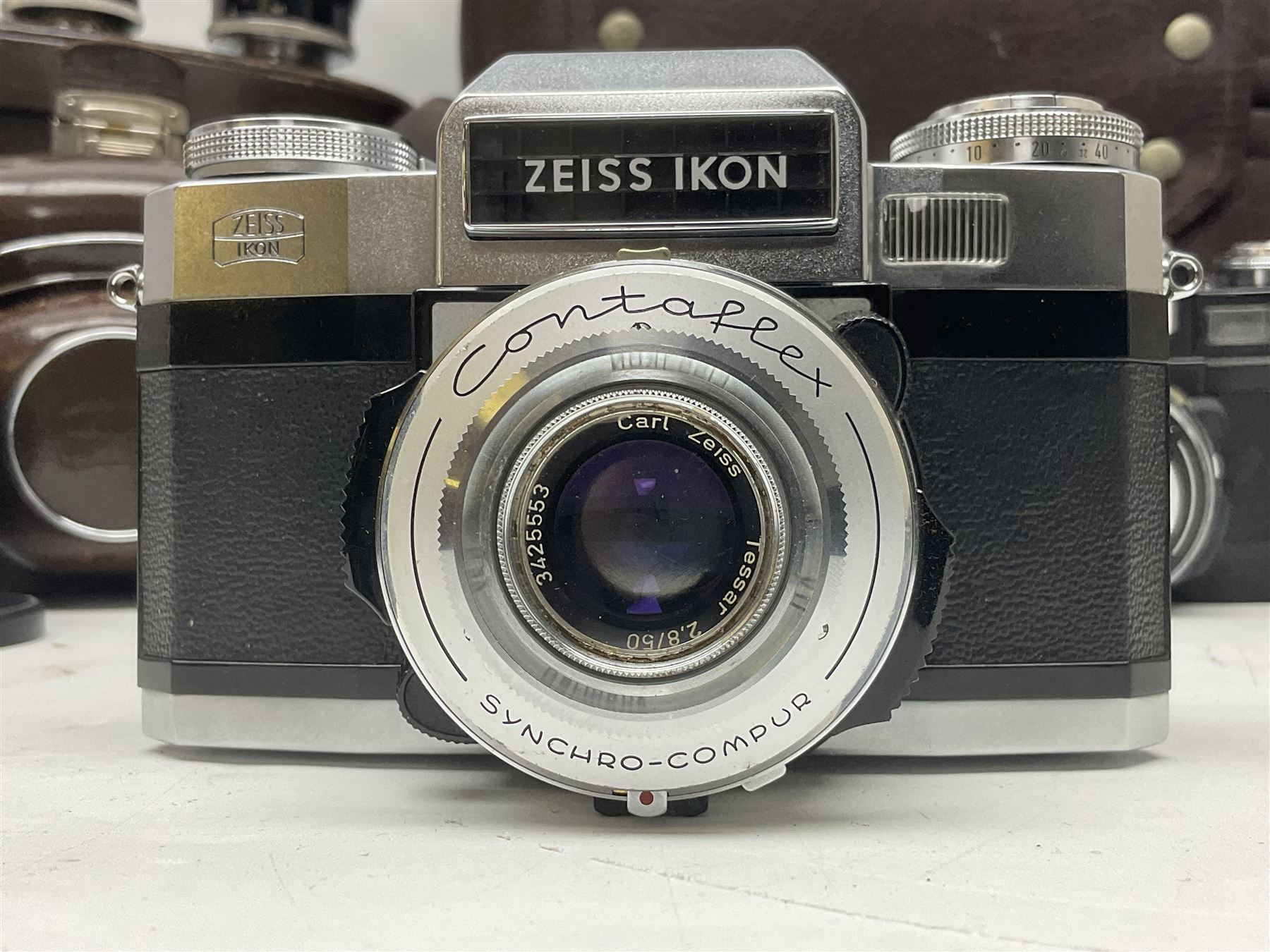 Four Zeiss Ikon camera bodies, to include, Contaflex Super B camera body, serial no. B31591, with 'Carl Zeiss Tessar 2.8/50 lens, serial no.3425553, Contaflex Super BC camera body, serial no. P81728, with 'Carl Zeiss Tessar 2.8/50' lens, serial no 4822280, etc, together with three cased lenses; 'Carl Zeiss Pro-Tessar 1:4 f=115mm' lens, serial no 3734740, 'Carl Zeiss Pr-Tessar 1:3.2 f=85mm' lens, serial no. 3647764 and 'Carl Zeiss Pr-Tessar 1:3.2 f=35mm' lens, and other Zeiss Ikon equipment 