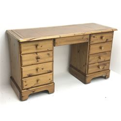 Polished pine twin pedestal desk, moulded rectangular top with inset leather, seven drawers and double height filing drawer, plinth base, W140cm, H77cm, D56cm