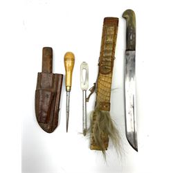 Leather belt sheath for an Ibberson yachting kit containing associated marline spike and shackle key, seaman's hardwood handled knife and wooden handled marline spike L25cm; and machete style long knife, the 28cm steel fullered blade marked Lindner & Co. Warranted, split horn grip and reptile skin scabbard (2)