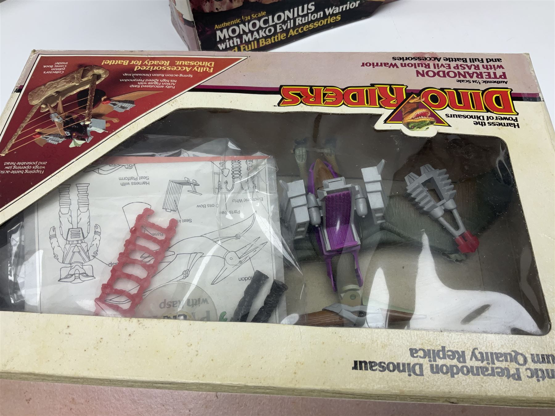 Three Tyco Dino-Riders by Action GT playsets - Pteranodon with Rasp Evil Rulon Warrior; Monoclonius with Mako Evil Rulon Warrior; and Placerias with Skate Evil Rulon Warrior; all boxed (3)