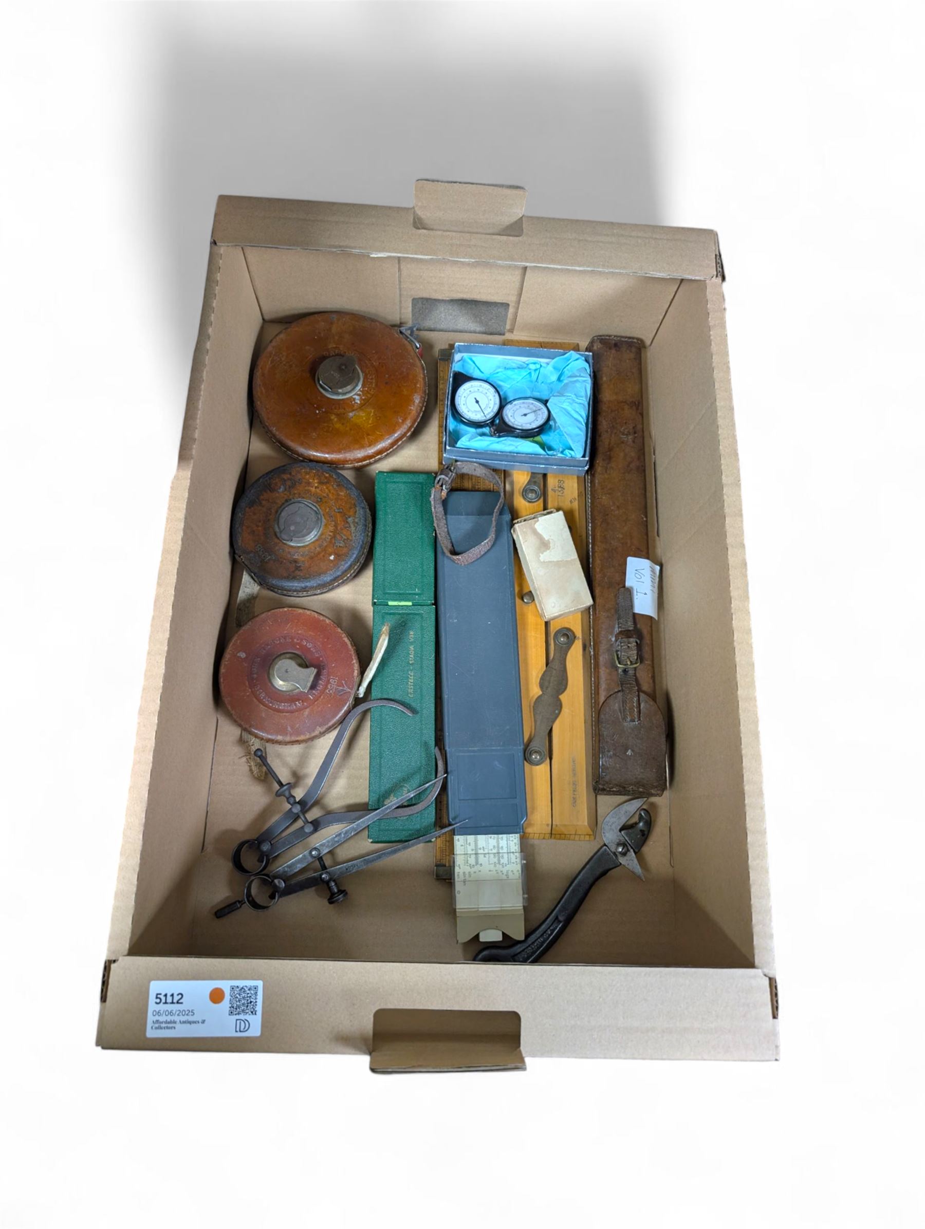 Three Rabone tape measures in leather cases, one with broad arrow, three map wheels, pair of Moore & Wright calipers, W Harling alidade in Whippy leather case with broad arrow and a collection of slide rules