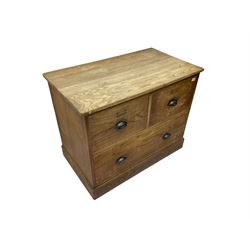 Early to mid-20th century oak chest, fitted with two short drawers over one long drawer, raised on plinth base