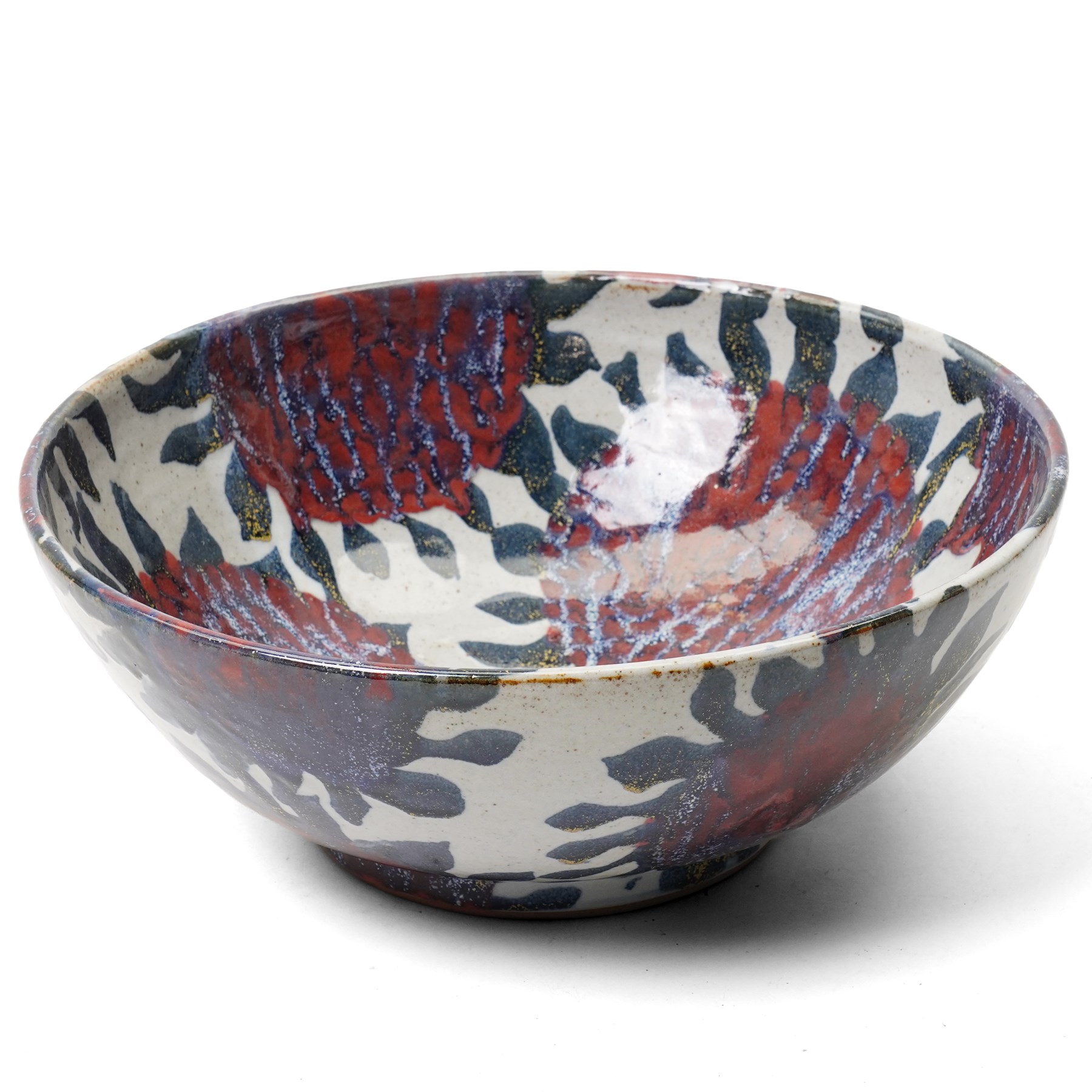 Sophie Hamilton (1963-): Sunflower bowl, decorated with blue and red sunflowers on a pale ground, unmarked, D34cm