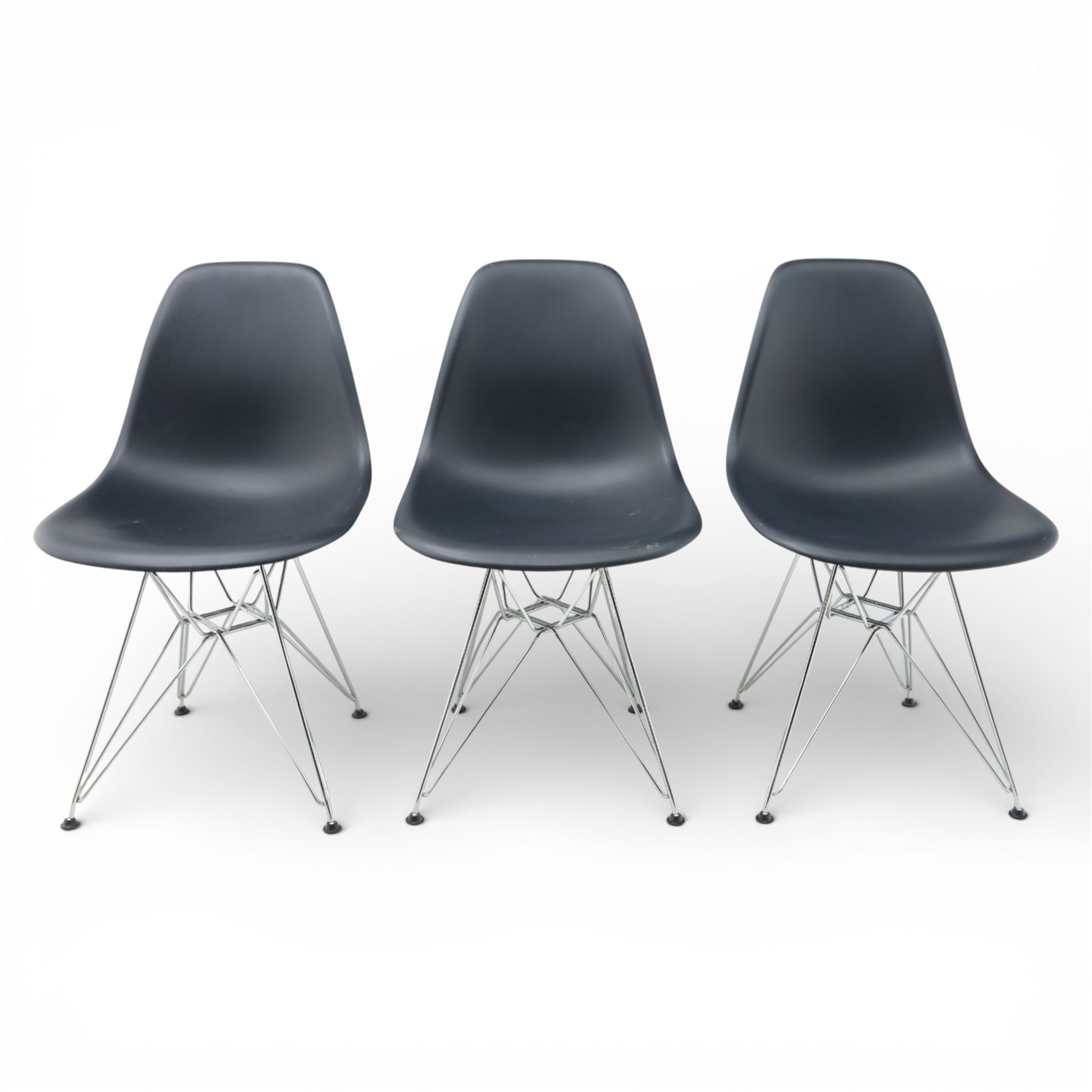 Vitra - set of six DSR side chairs designed by Charles and Ray Eames, moulded black plastic seats, raised on chromed wire Eiffel bases with plastic foot glides