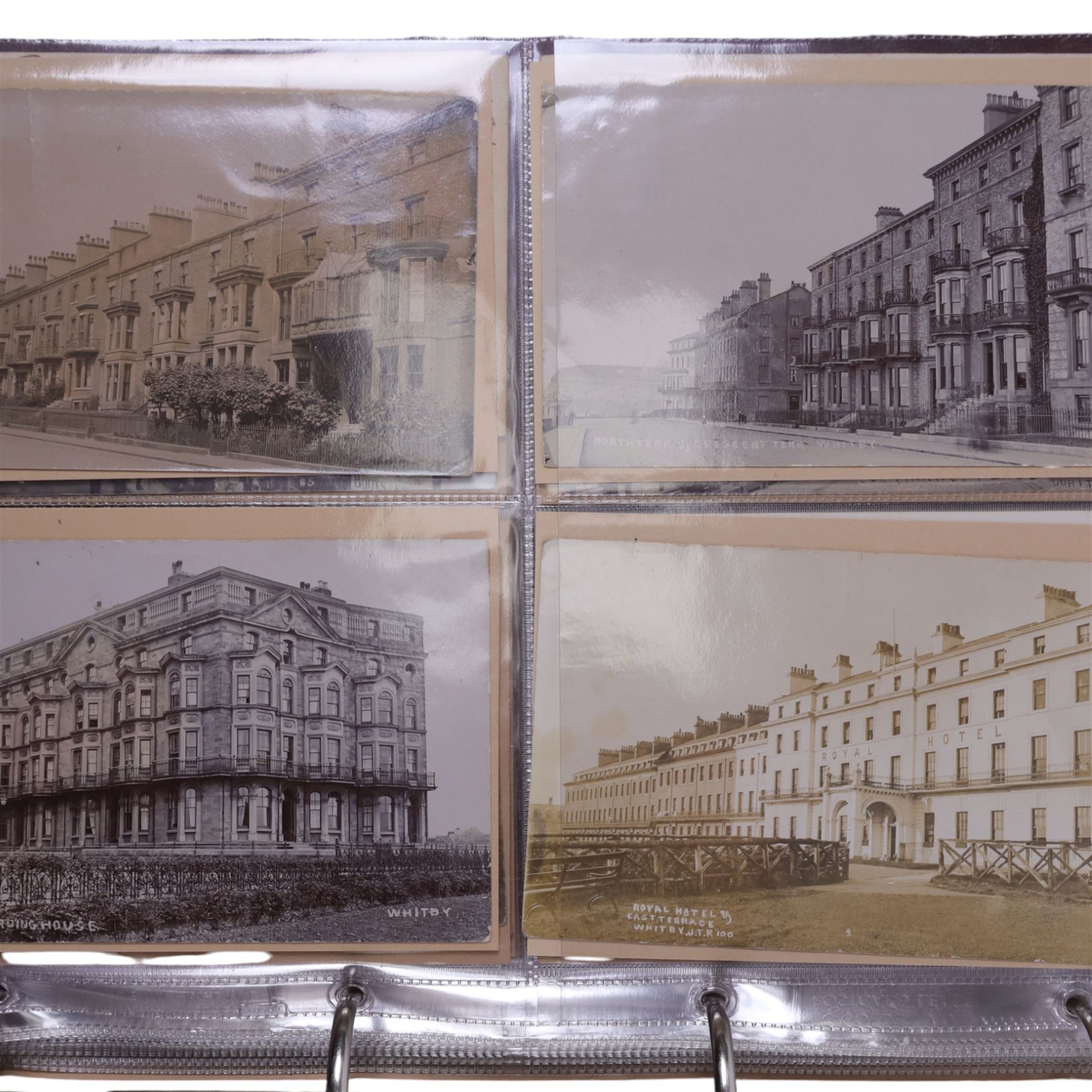 Five-hundred and thirty one late 19th and early 20th century real photographic postcards produced by J.T.Ross, depicting  daily life, village scenes, landmarks and street views of Whitby, the surrounding villages and South Teeside, including fifty-two modern copies, all housed within three postcard albums and accompanied by four copies of Ross, Photographer, Whitby 'The Life and Work of a Yorkshire Artist' by Colin Bullamore which provides a detailed overview of his life and work