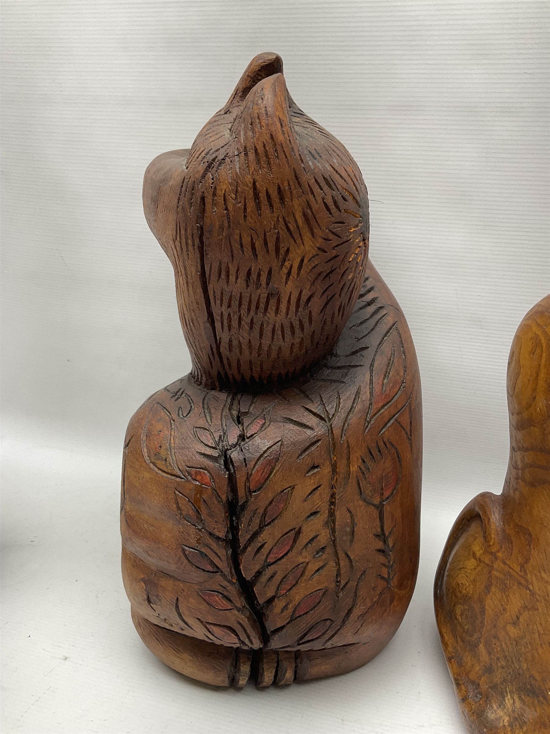 Helen Skelton (British 1933 – 2023): Three carved wooden abstract sculptures, each modelled as a cat, with carved or painted features, largest H63cm. Born into an RAF family in 1933 in Kent and travelled the world extensively during her childhood. After settling in Bridlington, Helen immersed herself in painting, textiles, and wood sculpture, often inspired by nature's beauty. Her talent was showcased in a one-woman show at Sewerby Hall and recognised with the sculpture prize at Ferens Art Gallery in 2000. Sadly, Helen’s daughter passed away from cancer in 2005. This loss inspired Helen to donate her sculptures to Marie Curie upon her passing in 2023.