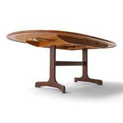 G Plan - Mid 20th century teak extending dining table and four chairs, oval top with stowed fold-over leaf extending to 208cm, raised on two shaped supports united by a stretcher 