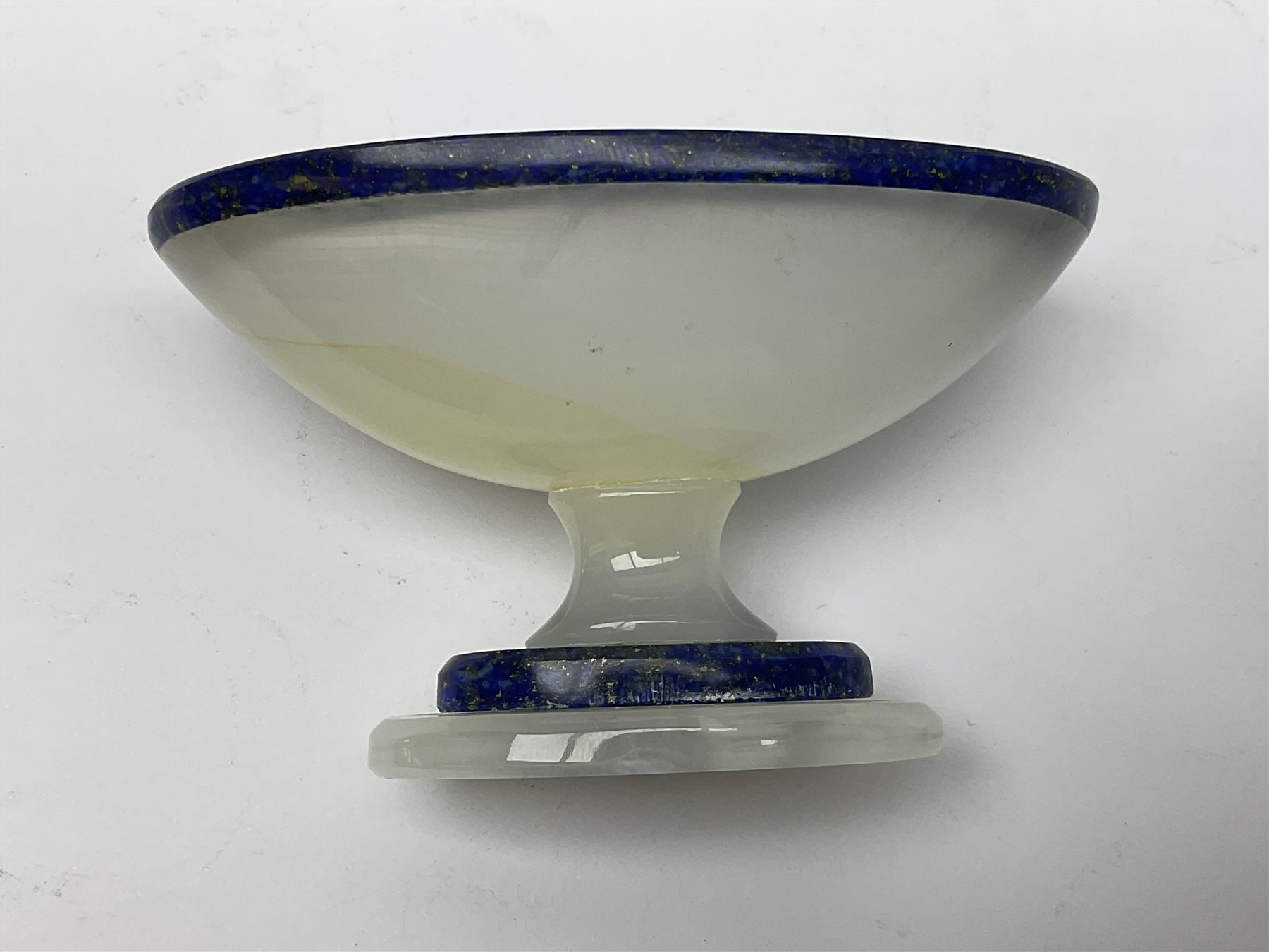 Pair of lapis lazuli and agate open salts, of navette form, upon a stepped oval pedestal foot, H5cm, L8cm
