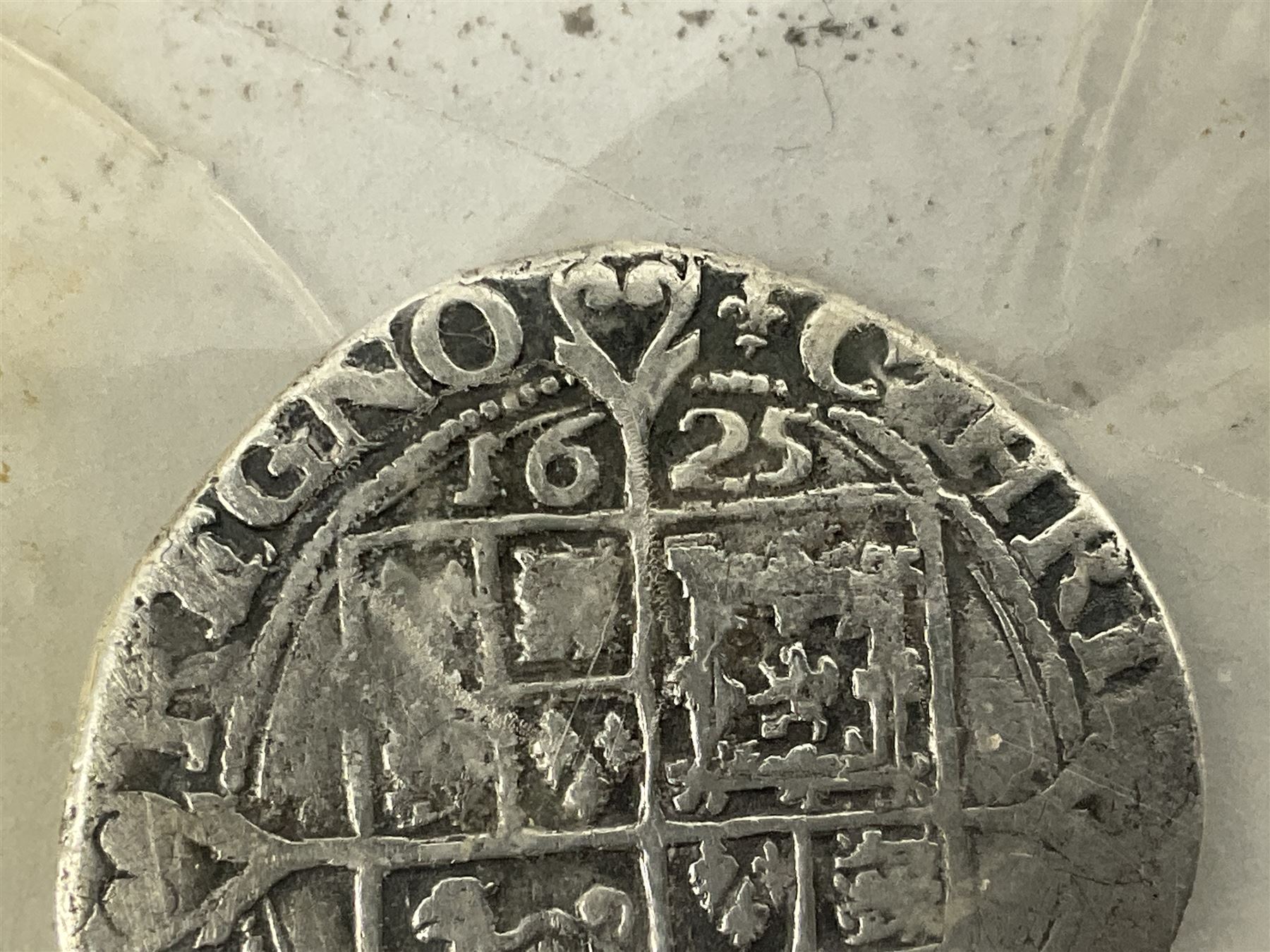 Charles I 1625 hammered silver sixpence, Queen Victoria 1894 crown coin and a cased hallmarked silver medal for the Hull photographic society, engraved '1940' 'Leonard Vokes', all housed in a red Pobjoy Mint coin box