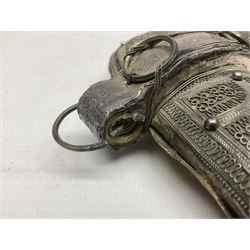 Omani Khanjar dagger, the 12.5cm curved blade with pronounced medial rib to either side, waisted horn style hilt with dome shaped pommel and inlaid pique work; in an intricately filigree decorated white metal scabbard with rings woven into the belt mount L25cm overall