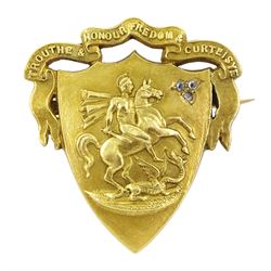 Early 20th century gold St George diamond brooch, with inscription Trouth & Honour Fredom & Curteisye, the shield set with three old cut diamond chips, the reverse inscribed Margaret Elier Oct 1915 July 1925'