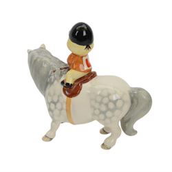 Two Beswick figures, comprising Boy on palomino pony no 1500 and Thelwell Angel on Horseback