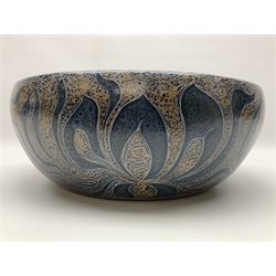 John Egerton (c1945-): studio pottery stoneware serving dish, decorated with abstract floral petals on a dark blue ground, D30cm