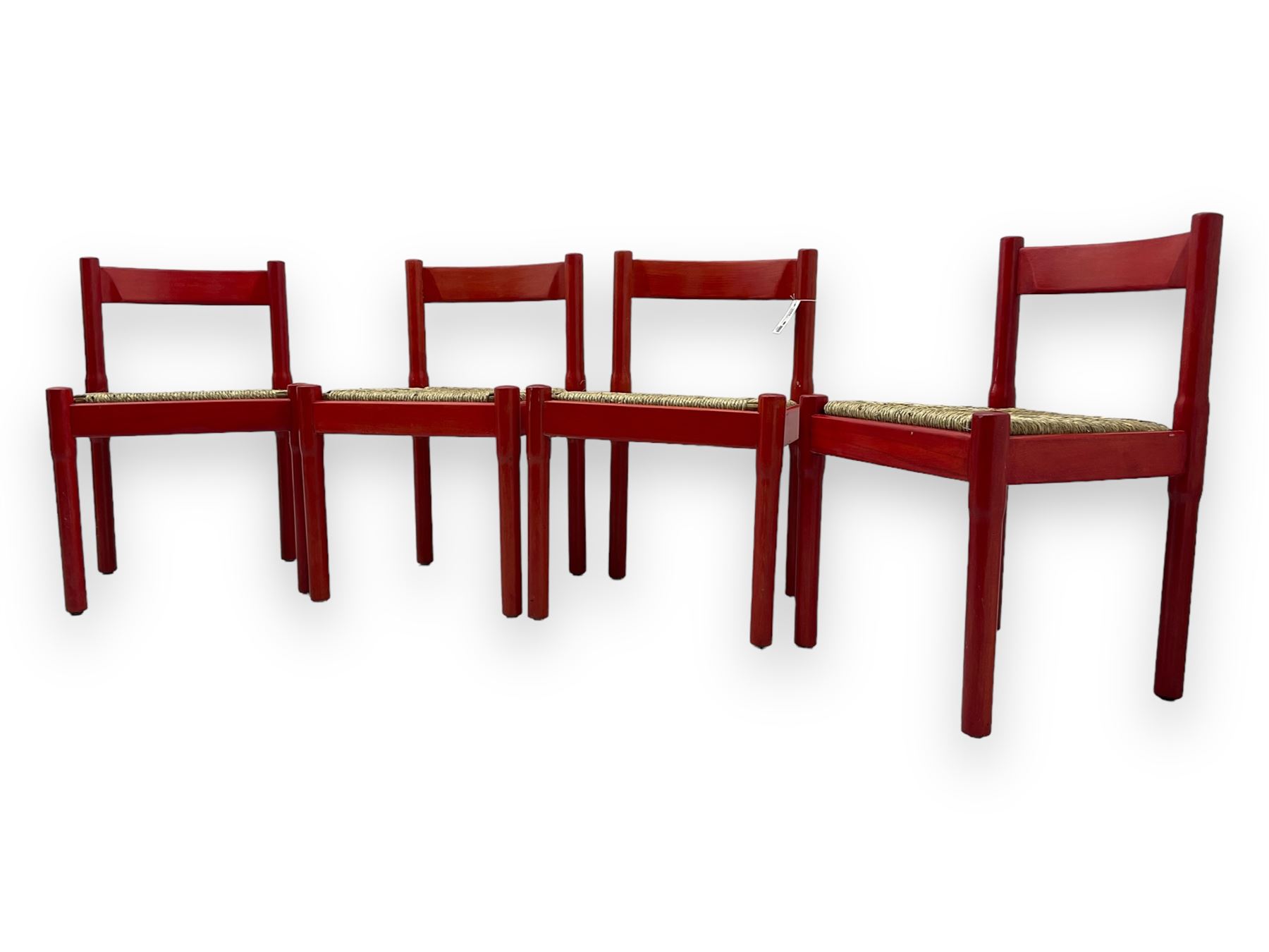 Vico Magistretti - mid-20th century circa. 1970s set of four beech framed dining chairs in red finish, with drop-in rush seats
