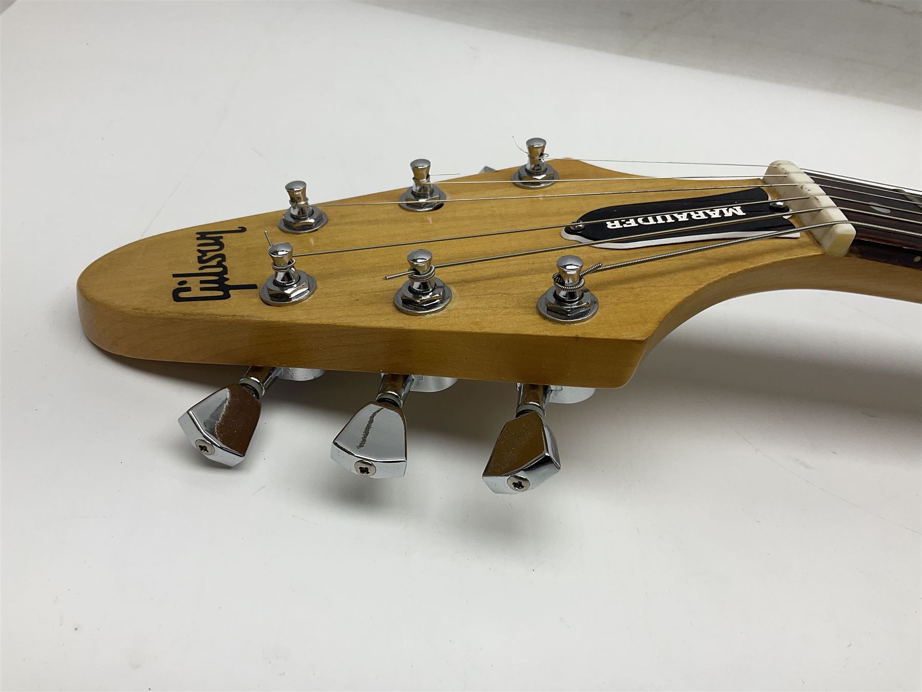 Gibson Marauder style six-string electric guitar with cherry coloured body, marked made in Japan L101cm; in locking hard carrying case