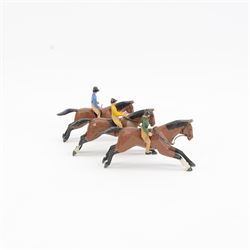Three early-mid 20th century carved and painted wooden jockeys on horseback, attributed to Frank Whittington of Forest Toys, Brokenhurst