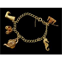 Gold curb link chain bracelet, with five gold charms including seahorse, palace, pair of shoes, boot and kettle, all hallmarked 9ct