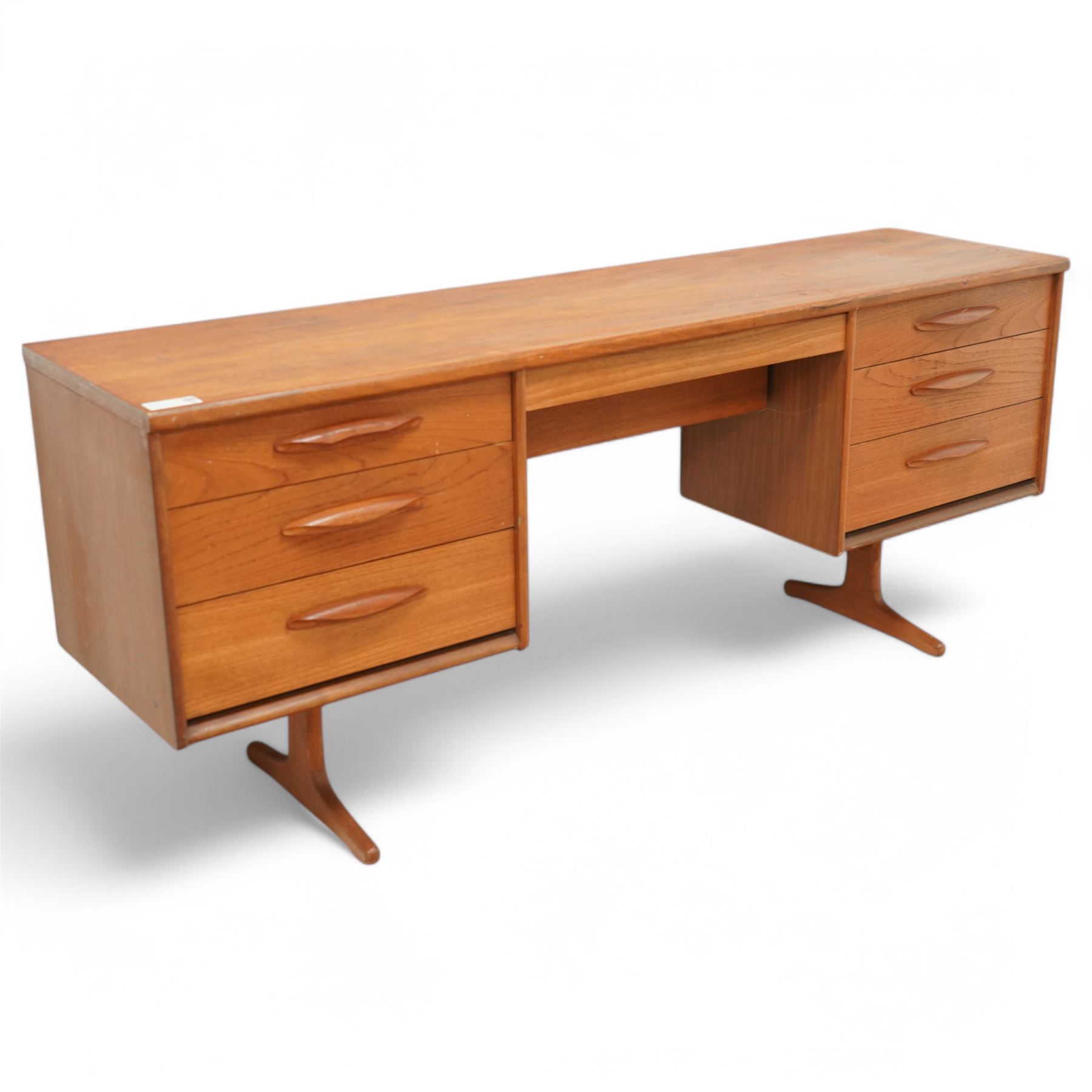 Austinsuite - mid-20th century teak dressing table or desk, fitted with seven drawers