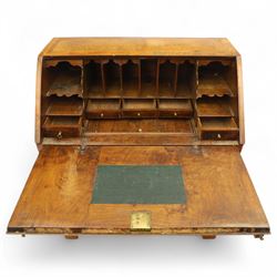 18th century walnut and herringbone banded bureau, the fall front enclosing a stepped and arched interior fitted with pigeonholes, drawers and concealed compartments, green tooled leather writing surface, over two short and three long graduated drawers with brass escutcheons and bail handles, shaped bracket feet