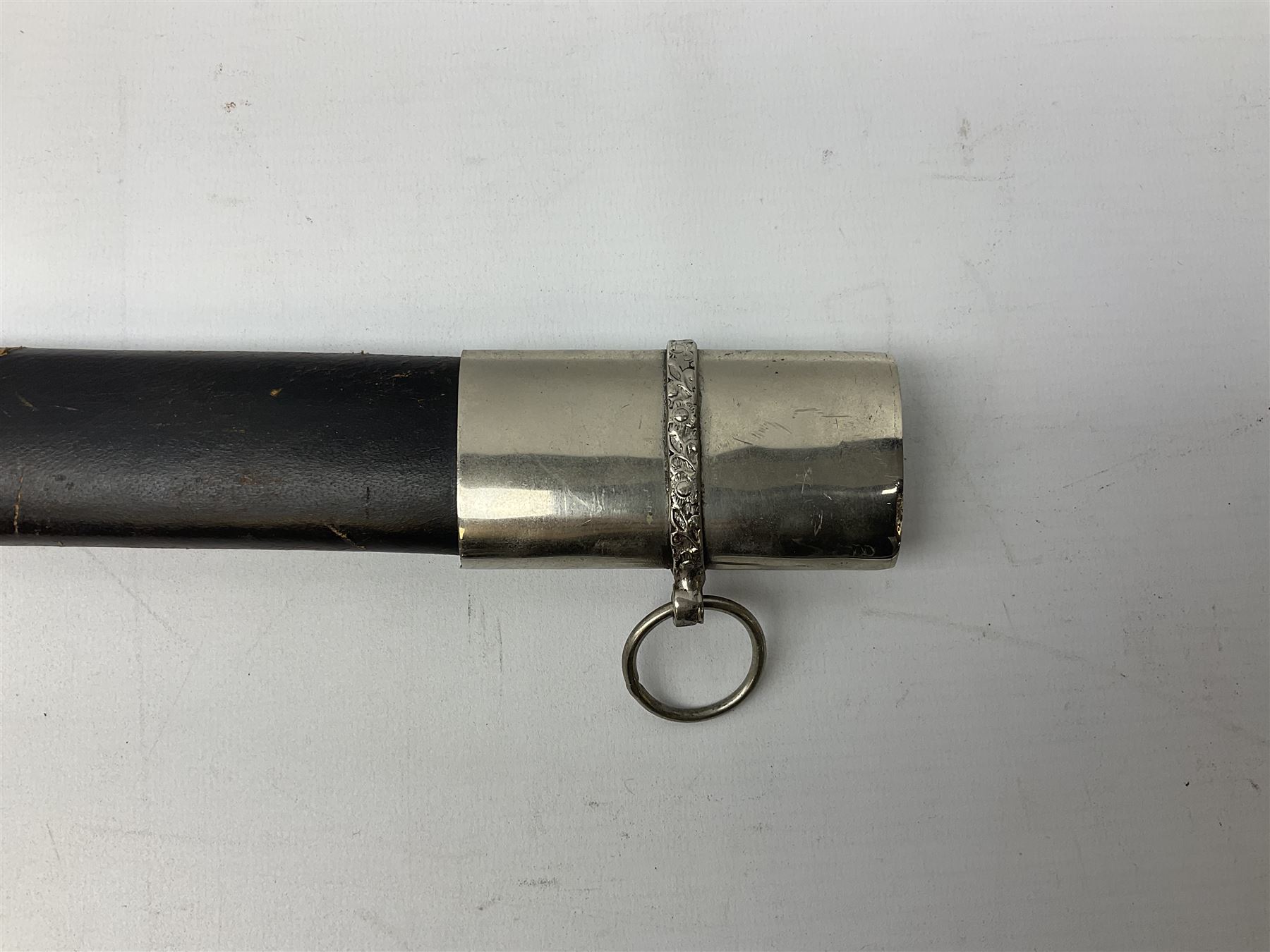 Reproduction Scottish basket hilted broadsword with 85cm double edged steel blade and red lined basket hilt with wire bound grip, in white metal mounted leather scabbard 107cm overall