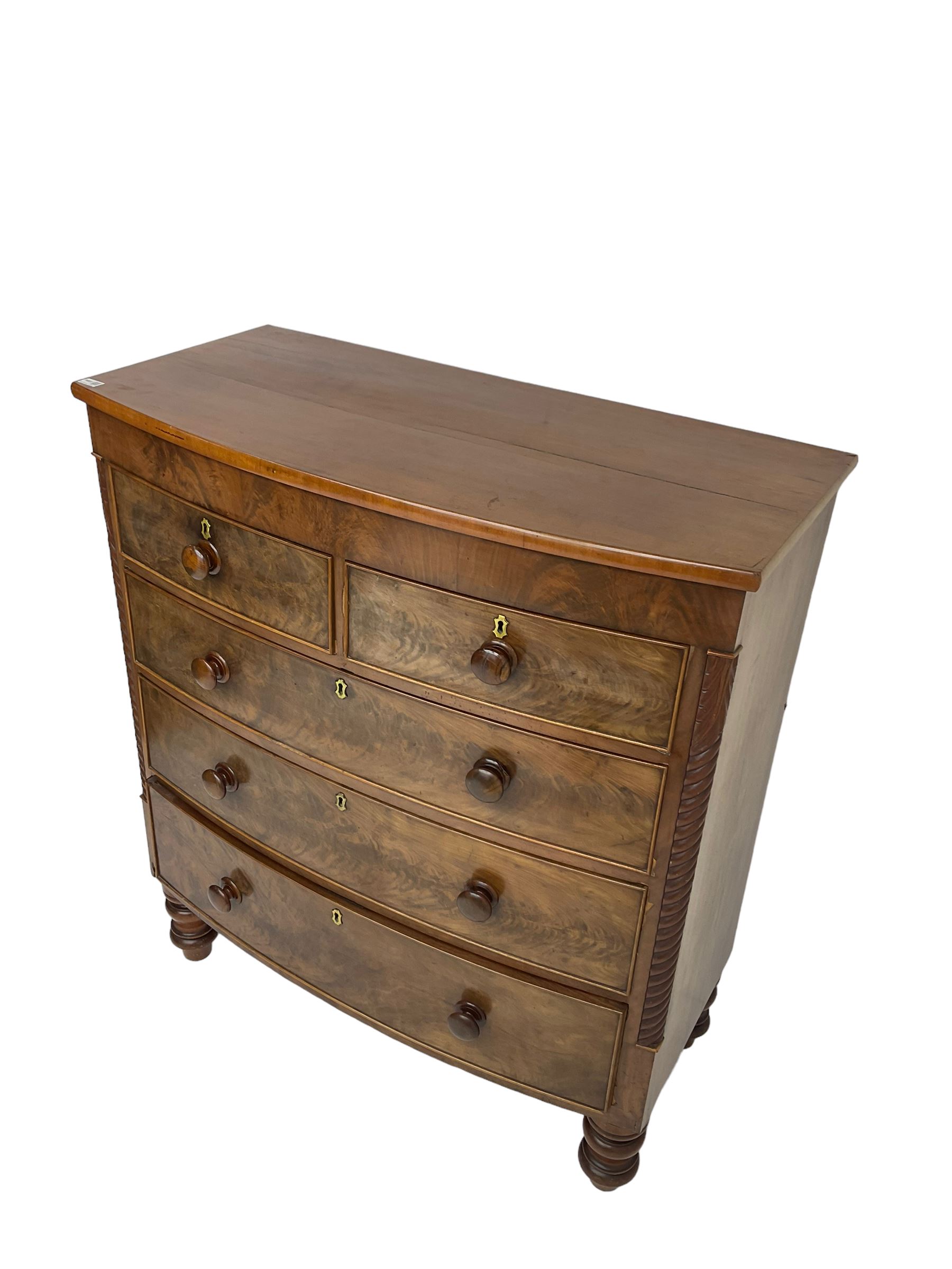 Late 19th century mahogany bow-front chest, fitted with two short drawers over three long drawers each with cockbeaded fronts, raised on turned feet