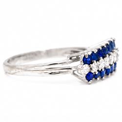 White gold diamond and sapphire three row ring, eight round brilliant cut diamonds, set between two rows of round cut sapphires, stamped 18ct, total diamond weight approx 0.30 carat