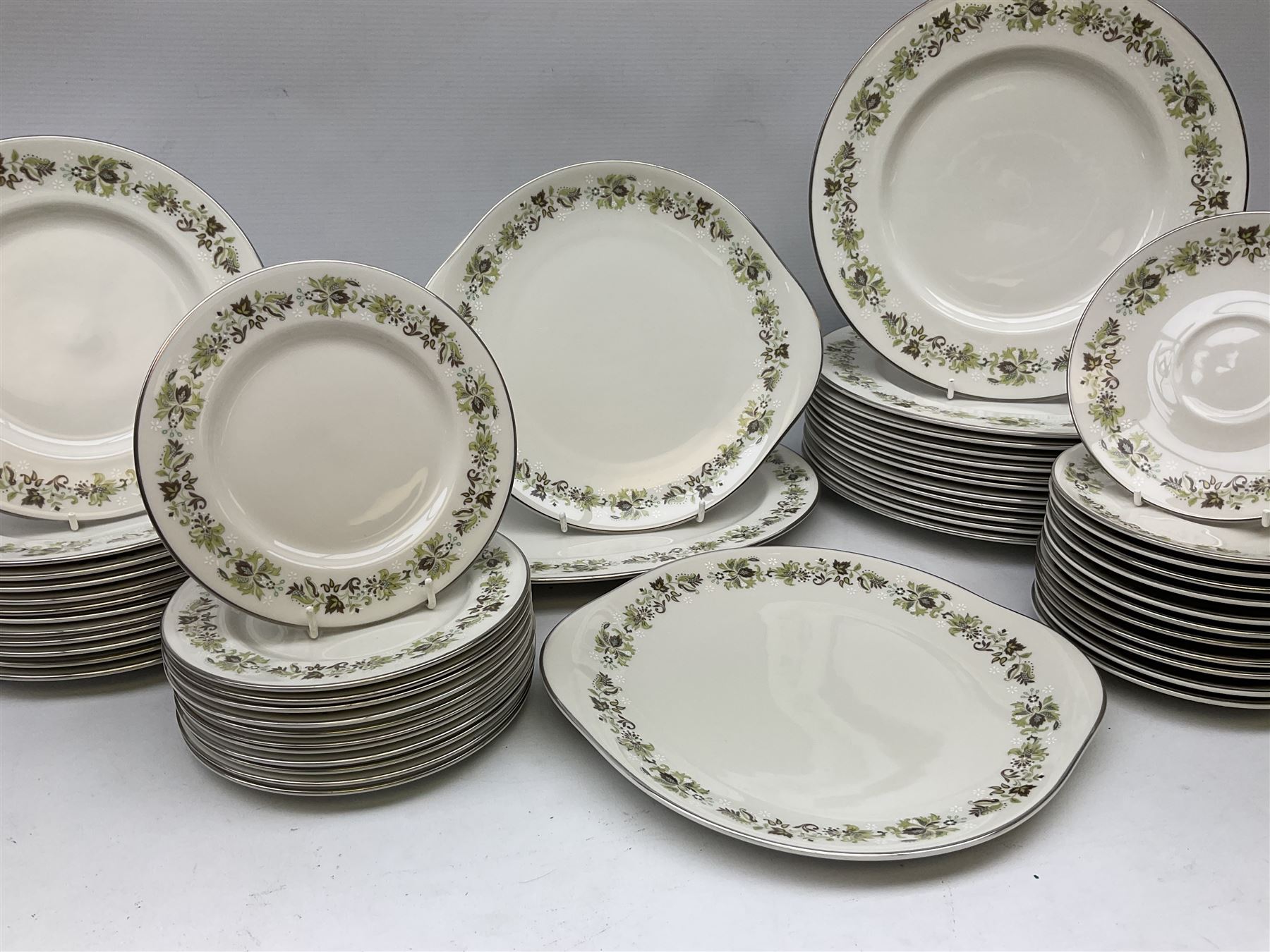 Royal Doulton tea and dinner wares decorated in the Vanity Fair pattern, to include twelve dinner plates, twelve side plates, eleven bowls, three lidded tureens, ten teacups, sauceboat on stand etc, together with boxed Royal Worcester plate, six Royal Worcester ramekins etc