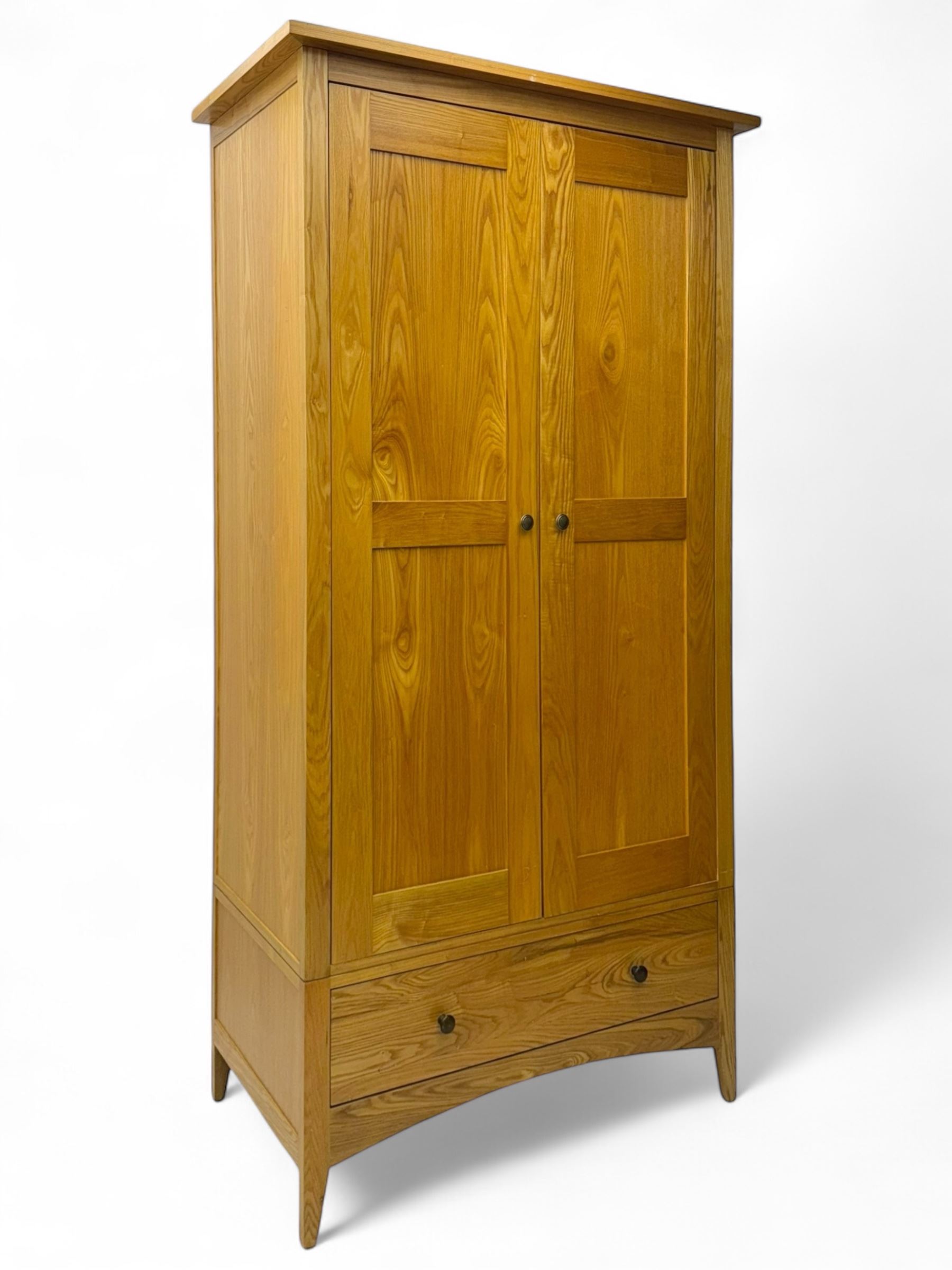 Light oak wardrobe, adjustable clothes rail and single shelf above a single drawer on squared splayed legs