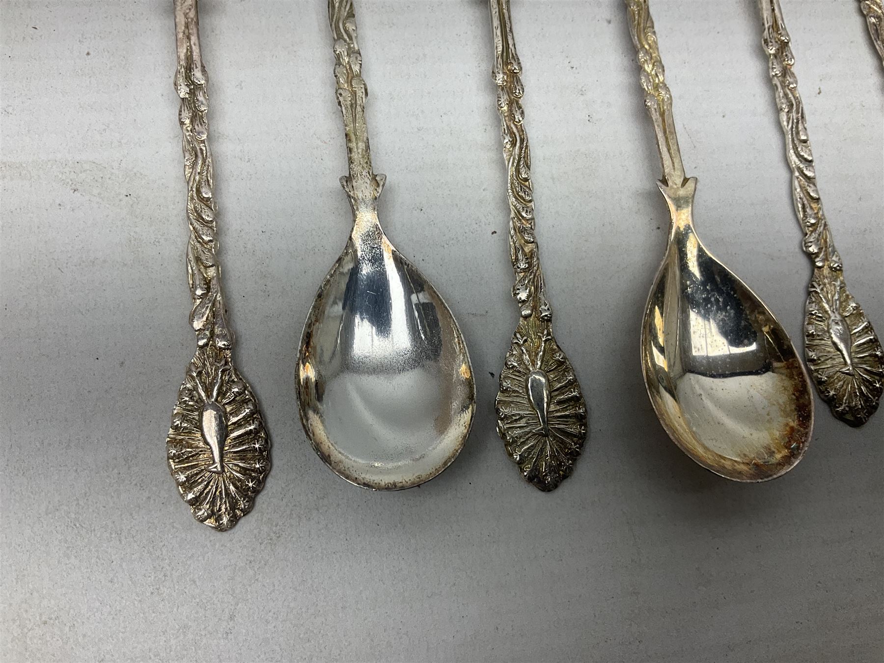 Set of four Continental silver spoons and forks, with stylised terminals, a number stamped S800, approximate weight 88.4 grams