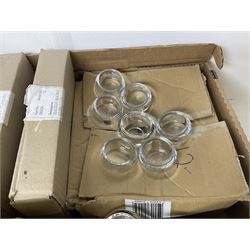 Fourteen bevelled mirror plates, D30cm, together with approximately twenty four glass candle sticks and a large quantity of glass candle collars and tealight holders, in three boxes