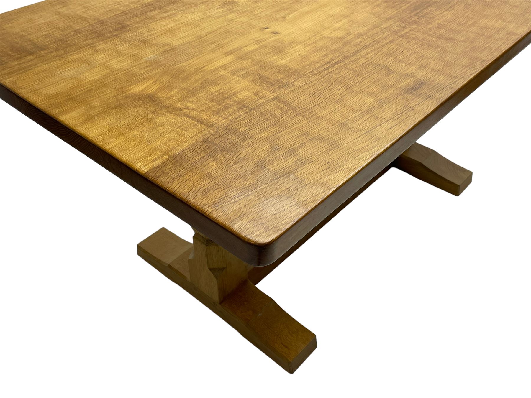 Mouseman - oak dining table, adzed rectangular top on twin octagonal pillar supports, sledge feet united by floor stretcher, by the workshop of Robert Thompson, Kilburn 