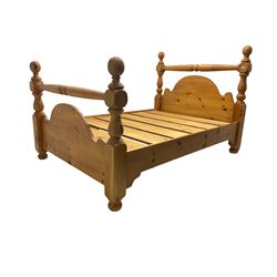 Traditional waxed pine 4’ 6” double bedstead, turned headboard cresting rail and shaped back with baluster uprights