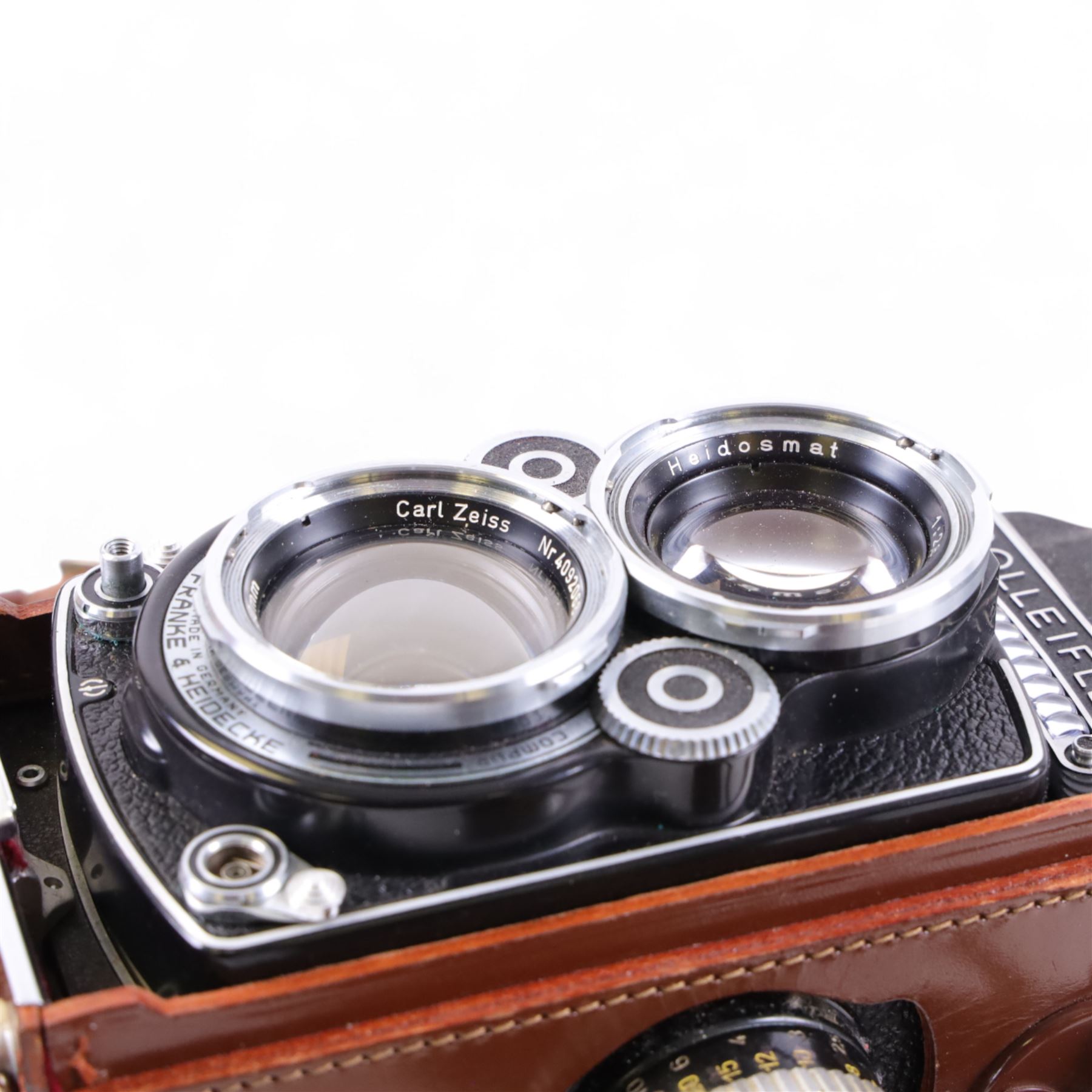 Rolleiflex Franke & Heidecke DBP DBGM 2.8 F TLR camera serial no. 2439093, with a Heidosmat 1:2.8/80 lens serial no. 894062 and a Carl Zeiss Planer 1:2.8 f=80mm lens serial no. 4092068, in leather case with instruction booklet