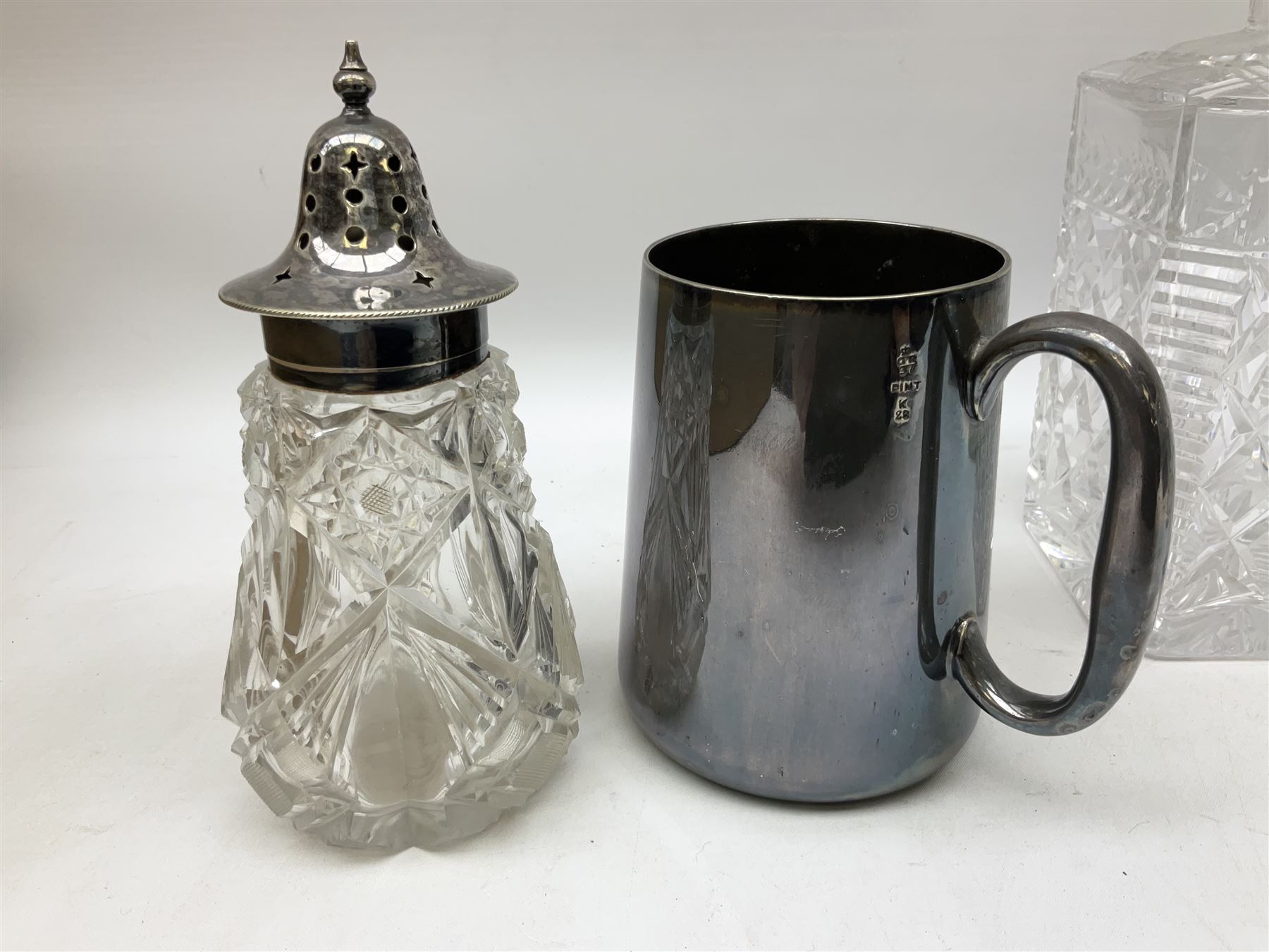 Quantity of assorted silver plated and other flatware, to include part sets, set of three silver plated cruets, glass sifter with silver plated cover, two glass decanters and stoppers, etc., in one box 