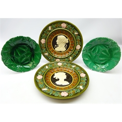  Pair Austrian Schutz Blansko majolica chargers decorated in relief with classical maidens within a trailing Rose border, D31cm and two 19th century Copeland Majolica leaf moulded plates (4)  