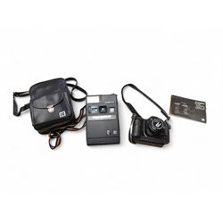 Canon T90 camera and a Kodak EK 160-EF camera