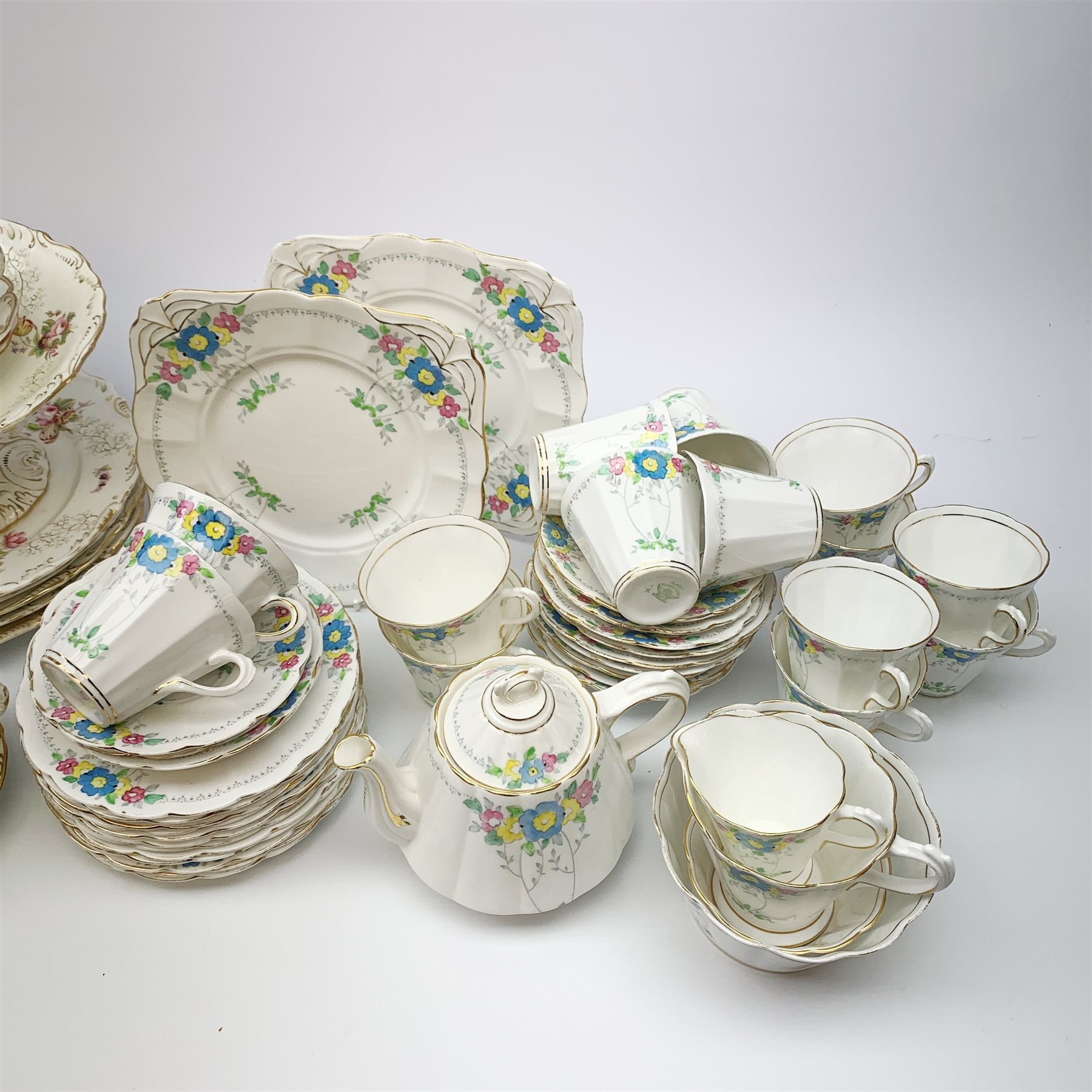 A Plant Tuscan china tea set, comprising teapot, fourteen teacups and fourteen saucers, twelve side plates, milk jug, cream jug, slop bowl, open sucrier, and two sandwich plates, together with a selection of Victorian dessert wares, and matched tea cups and saucers. 