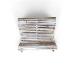 19th century cast iron and wood slatted garden bench, high scroll back form, low X shaped base, finished in distressed white paint