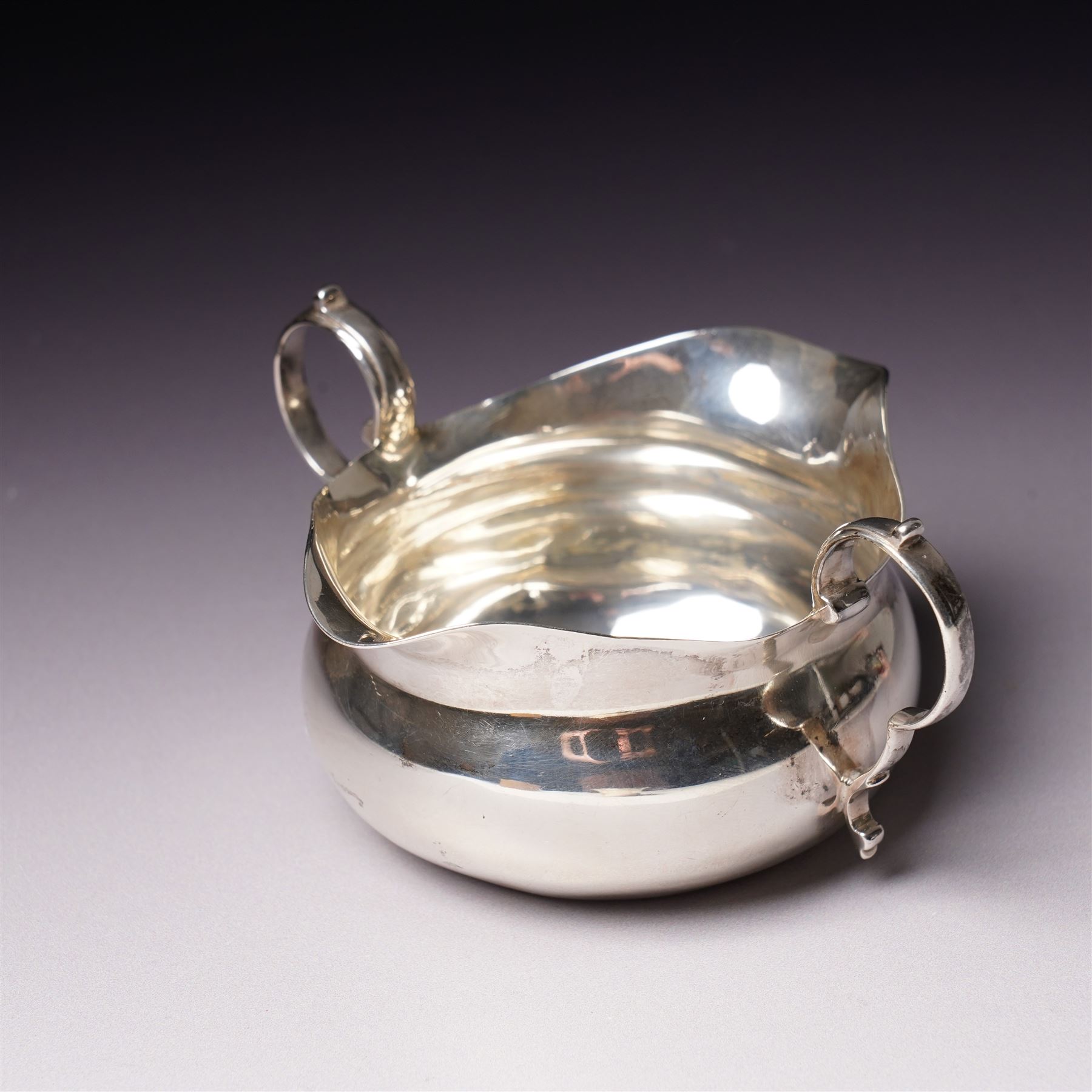 Edwardian silver two handled double lipped sauce boat Chester 1905 Maker Stokes & Ireland Ltd and a silver bowl D12cm Sheffield 1910 